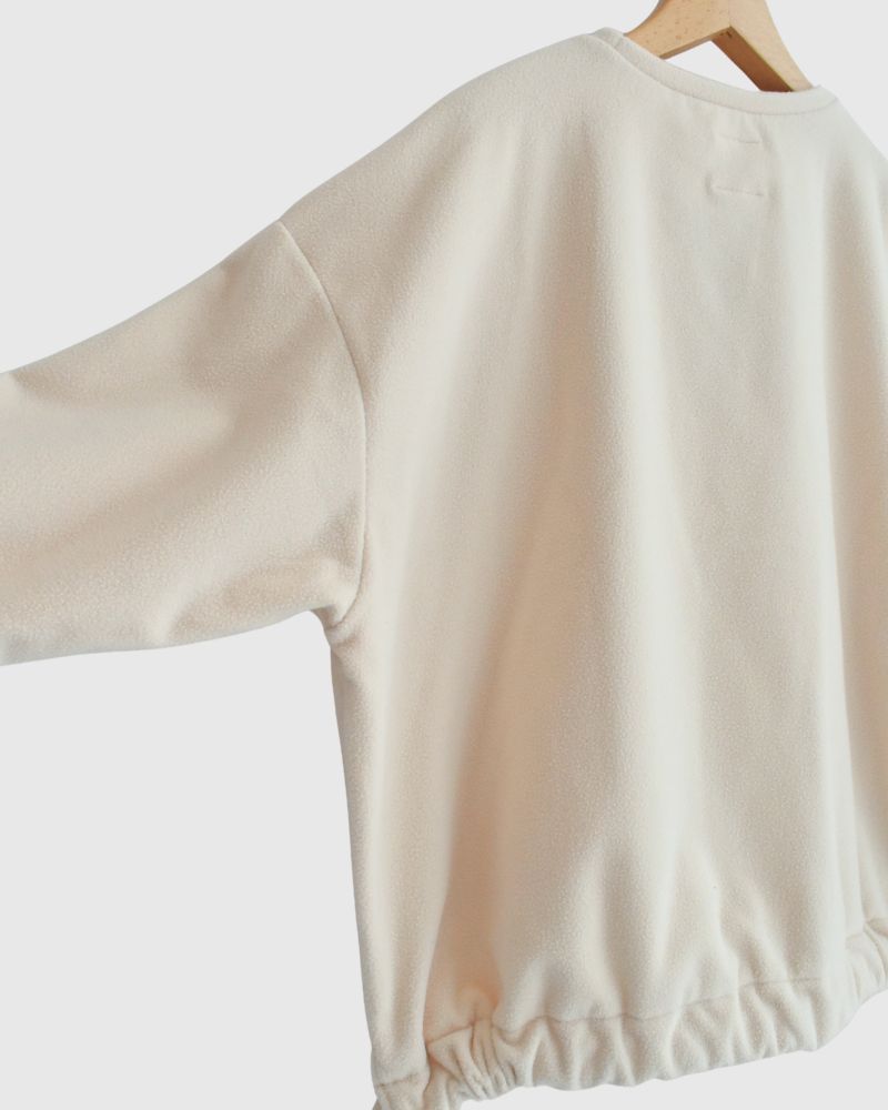 Fleece hem ribbon pullover in Milk