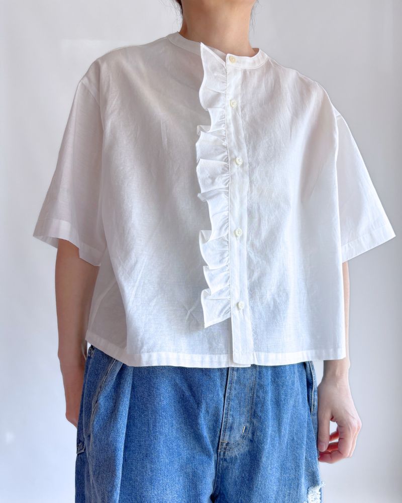 white silk blouse with a frill